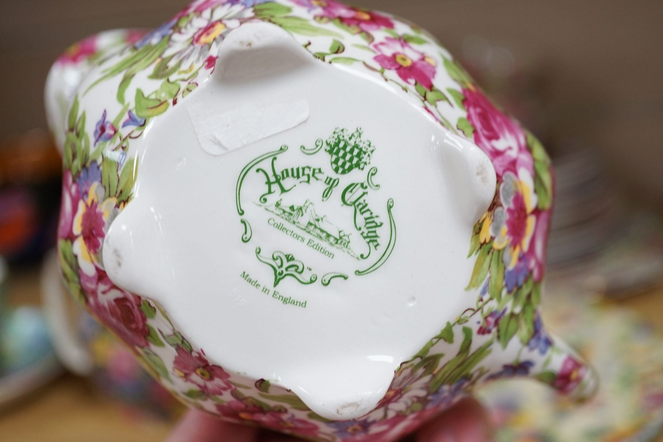 A Clarice Cliff tea cup, a collection of chintz patterned teaware, a lustre bowl and a honey pot and cover